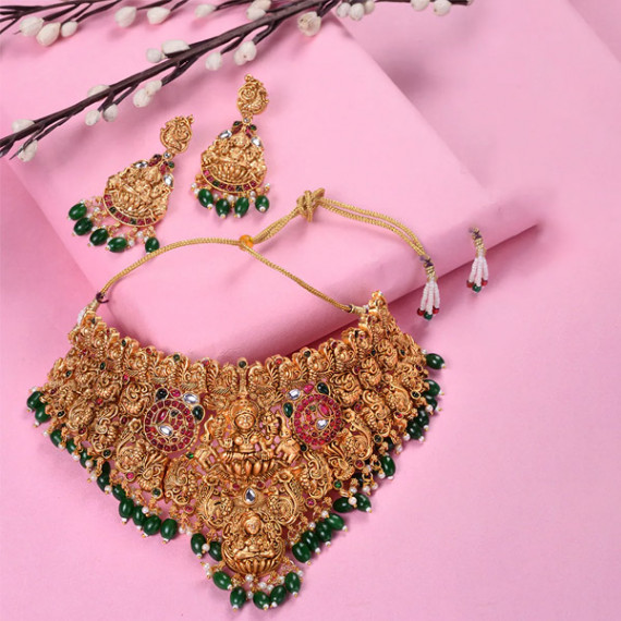 http://13.232.74.28/vi/products/gold-plated-kemp-stone-studded-lakshmi-design-with-dangling-green-beads-choker-set